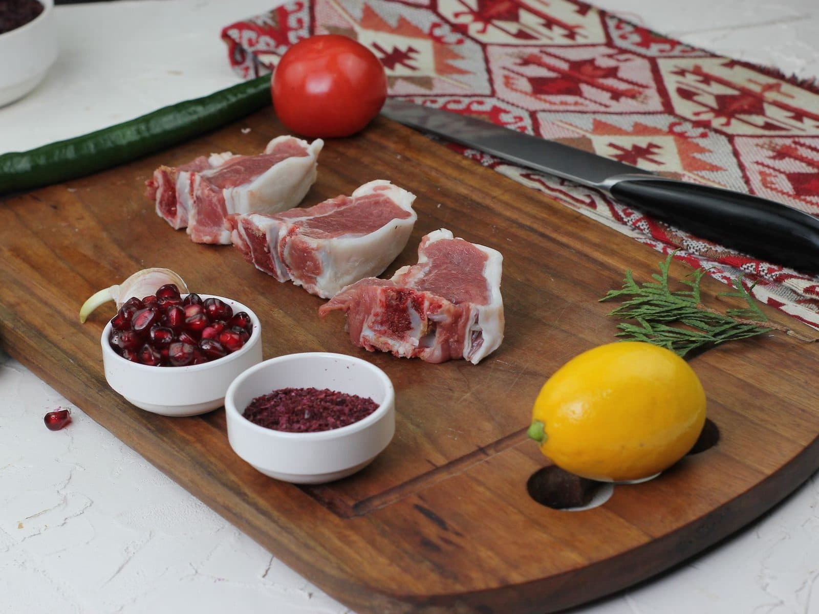 Fresh raw mutton pieces on a wooden board (representative photo)